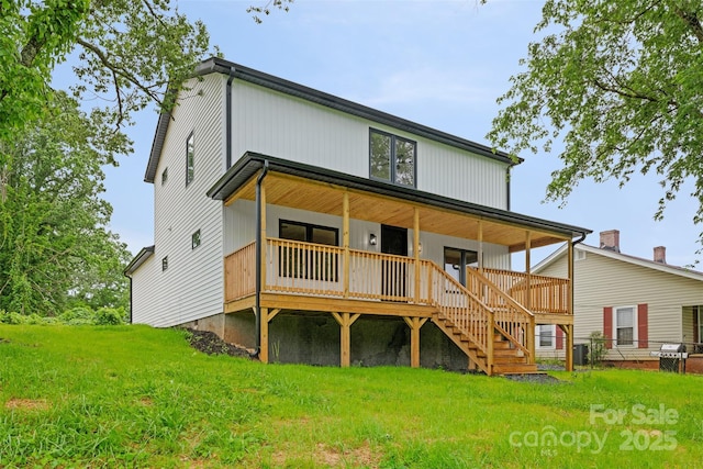 1076 W Henderson St, Marion, NC 28752 - rear view of house featuring a lawn, a porch, and stairway