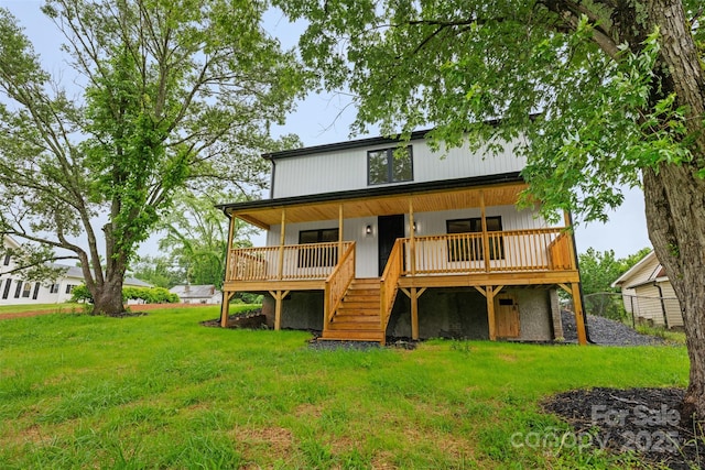 1076 W Henderson St, Marion, NC 28752 - back of property with a lawn and covered porch