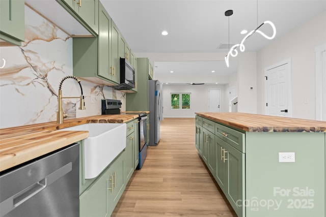 1076 W Henderson St, Marion, NC 28752 - kitchen featuring green cabinets, butcher block counters, and recessed lighting