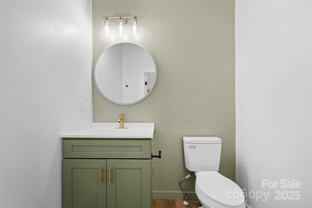 1076 W Henderson St, Marion, NC 28752 - bathroom with vanity, toilet, and wood finished floors
