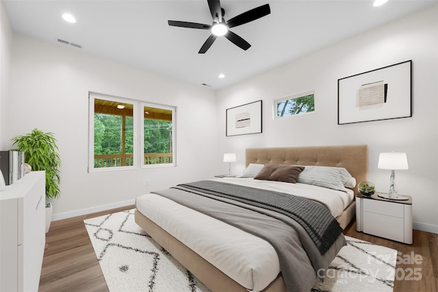 1076 W Henderson St, Marion, NC 28752 - bedroom with baseboards, recessed lighting, wood finished floors, and a ceiling fan
