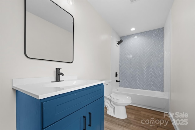 1076 W Henderson St, Marion, NC 28752 - full bath with vanity, toilet, wood finished floors, and shower / bath combination