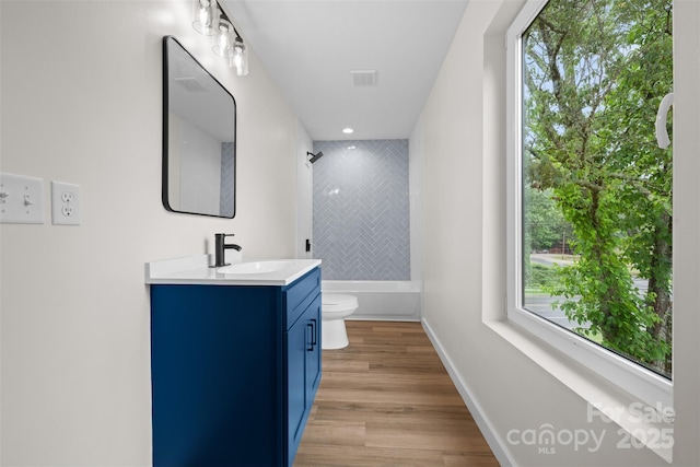 1076 W Henderson St, Marion, NC 28752 - bathroom with toilet, vanity, shower / washtub combination, and plenty of natural light