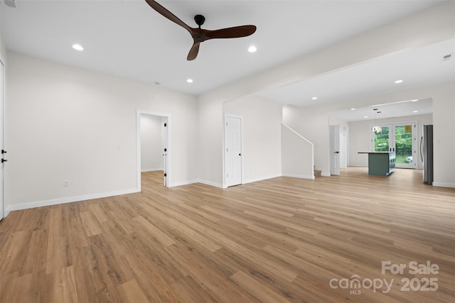 1076 W Henderson St, Marion, NC 28752 - unfurnished living room with a ceiling fan, light wood finished floors, baseboards, and recessed lighting