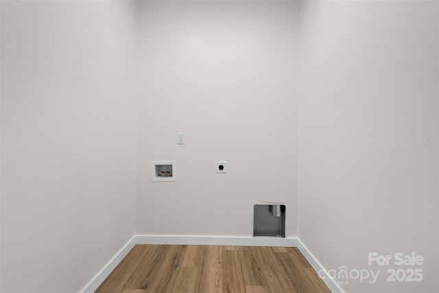 1076 W Henderson St, Marion, NC 28752 - laundry area featuring wood finished floors, washer hookup, baseboards, and hookup for an electric dryer