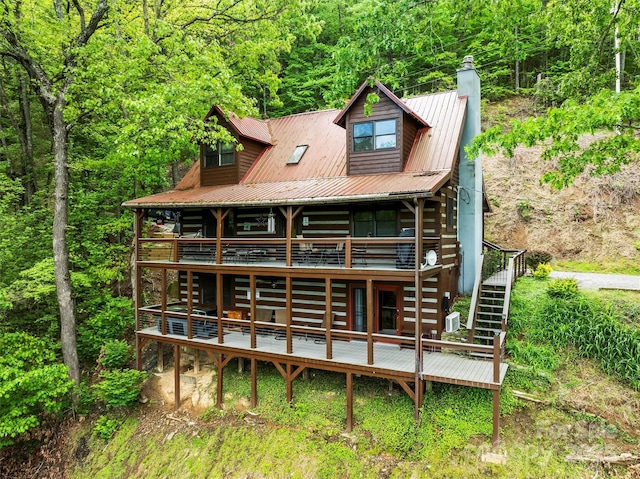 260 Smoky View Dr, Bryson City, NC 28713 - rear view of house with a deck, a chimney, stairs, a view of trees, and metal roof