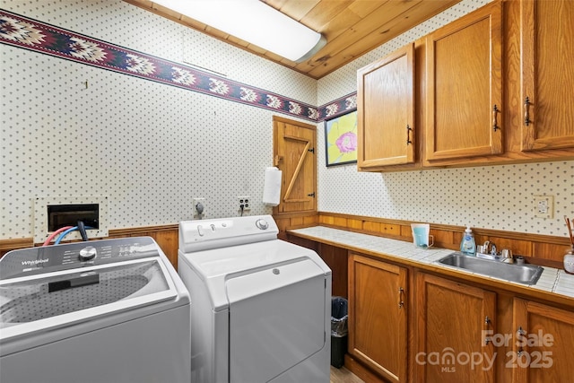 260 Smoky View Dr, Bryson City, NC 28713 - laundry area featuring wallpapered walls, washer and clothes dryer, and cabinet space
