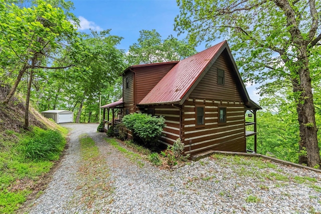 260 Smoky View Dr, Bryson City, NC 28713 - view of property exterior featuring an outbuilding, metal roof, and gravel driveway