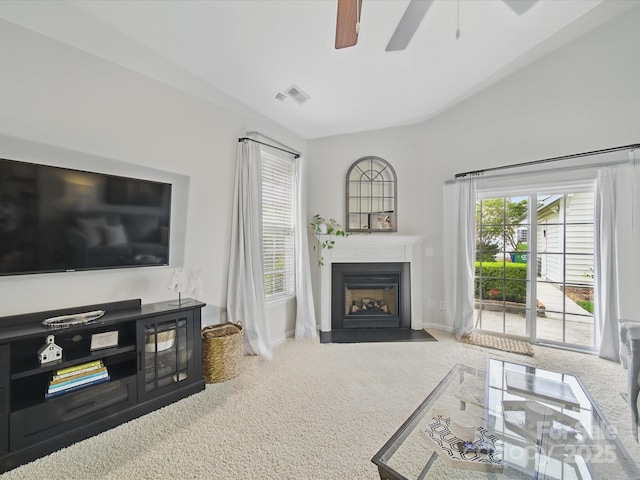 1061 Woodglen Ln, Matthews, NC 28104 - carpeted living room with a ceiling fan, a fireplace with flush hearth, and baseboards