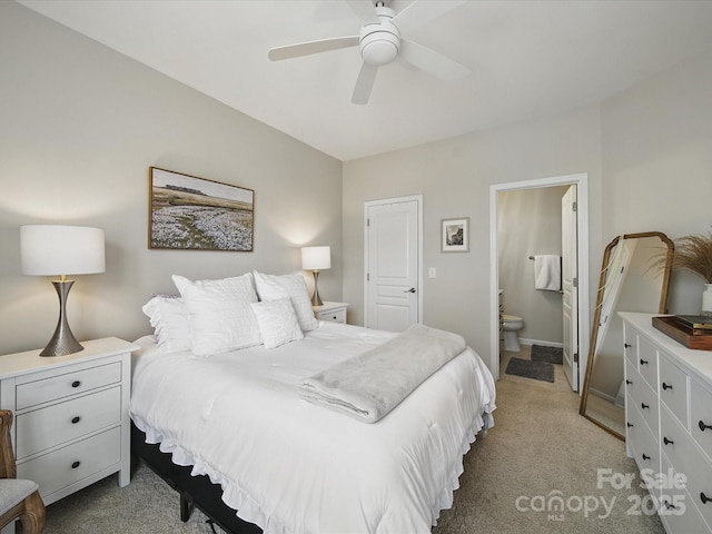 1061 Woodglen Ln, Matthews, NC 28104 - bedroom featuring light carpet, ensuite bathroom, and ceiling fan