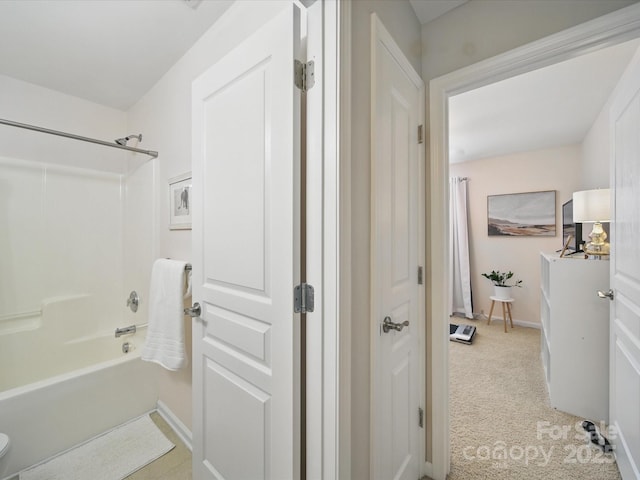 1061 Woodglen Ln, Matthews, NC 28104 - bathroom featuring tub / shower combination, baseboards, and toilet
