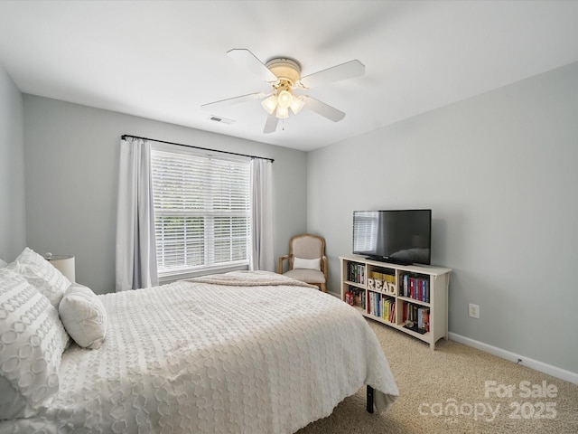 1061 Woodglen Ln, Matthews, NC 28104 - carpeted bedroom with baseboards and a ceiling fan
