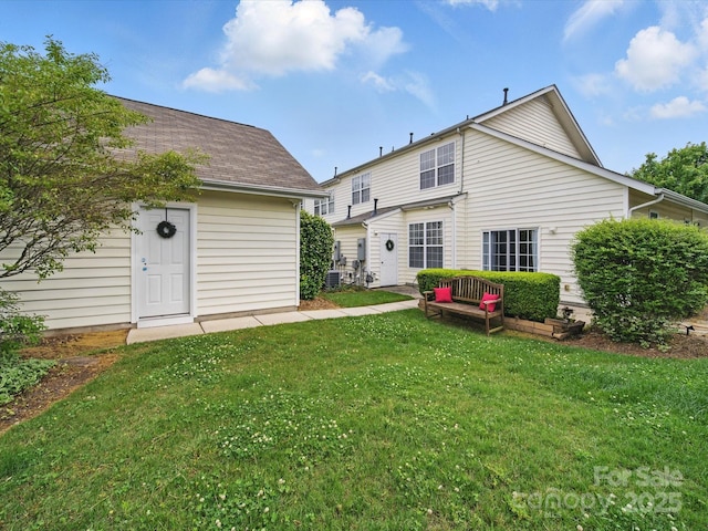 1061 Woodglen Ln, Matthews, NC 28104 - rear view of house with a lawn and central air condition unit