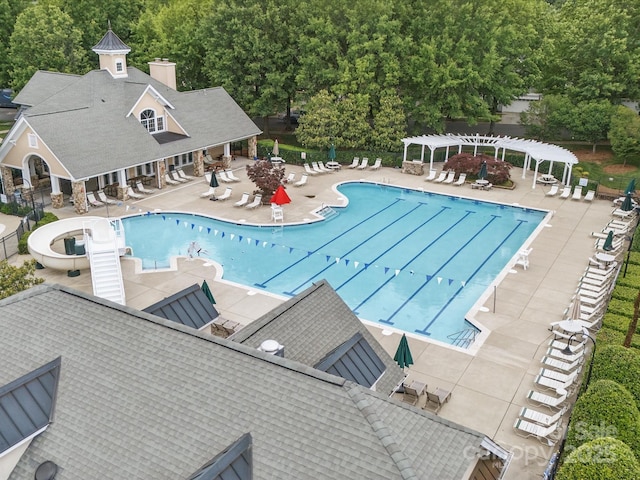 1061 Woodglen Ln, Matthews, NC 28104 - community pool featuring a pergola and a patio area