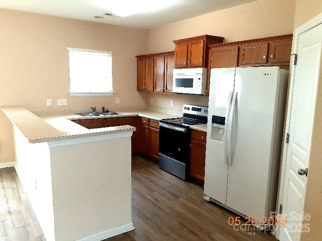 13441 Calloway Glen Dr, Charlotte, NC 28273 - kitchen with white appliances, a peninsula, a sink, and light wood-style flooring