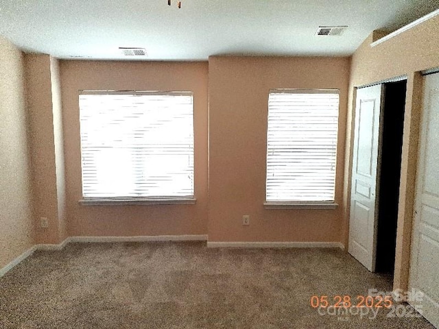 13441 Calloway Glen Dr, Charlotte, NC 28273 - unfurnished room with carpet flooring, baseboards, and healthy amount of natural light