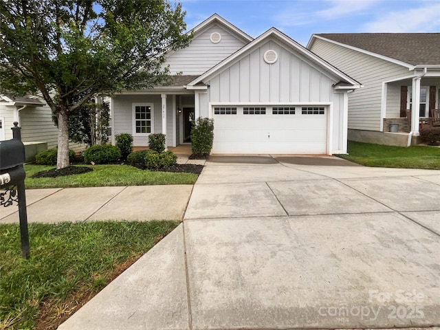 27415 Cinderella Cir, Lancaster, SC 29720 - ranch-style home with board and batten siding, a garage, driveway, and covered porch