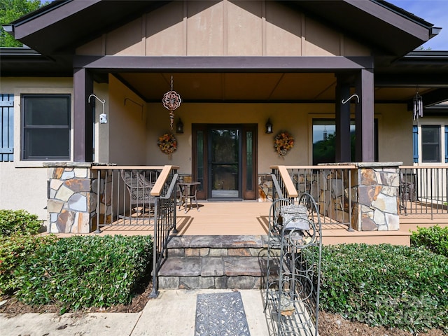 110 Village Pointe Ln, Asheville, NC 28803 - property entrance featuring a porch and stucco siding