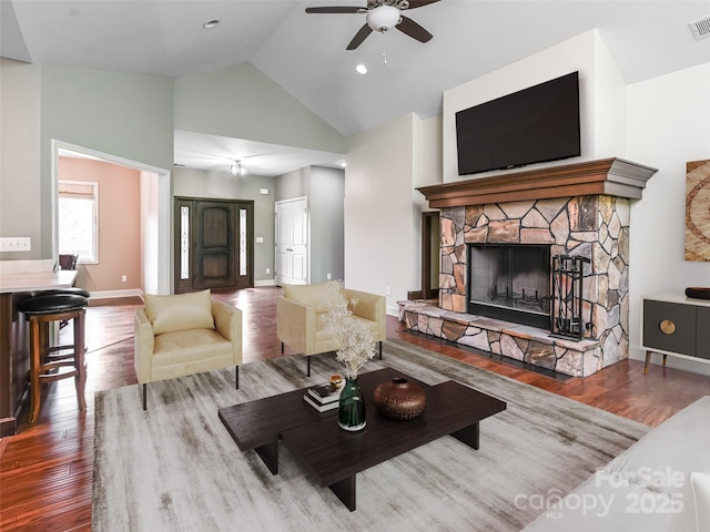110 Village Pointe Ln, Asheville, NC 28803 - living area featuring wood finished floors, ceiling fan, high vaulted ceiling, and a stone fireplace