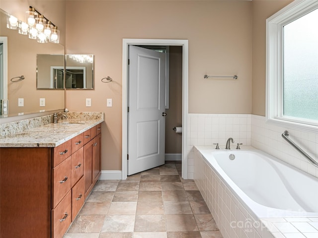 110 Village Pointe Ln, Asheville, NC 28803 - full bathroom with vanity, a garden tub, and stone finish flooring
