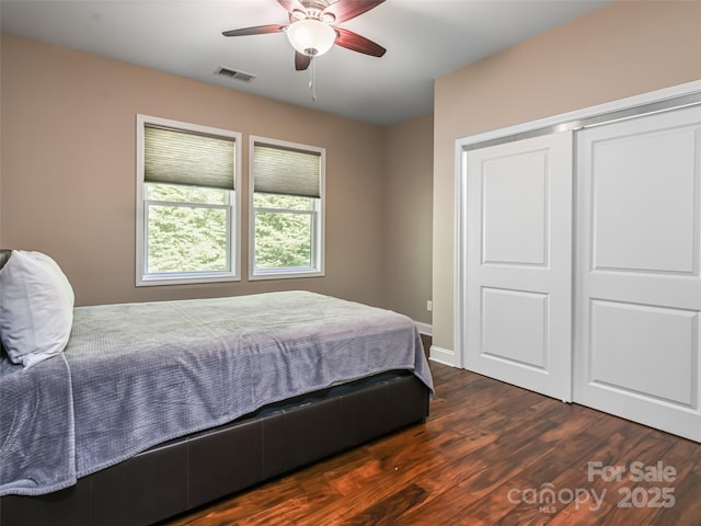 110 Village Pointe Ln, Asheville, NC 28803 - bedroom with dark wood-style flooring, a ceiling fan, and a closet