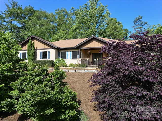 110 Village Pointe Ln, Asheville, NC 28803 - view of front facade featuring covered porch and board and batten siding