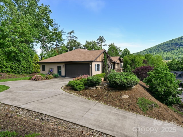 110 Village Pointe Ln, Asheville, NC 28803 - view of front of house with driveway, a garage, and a mountain view