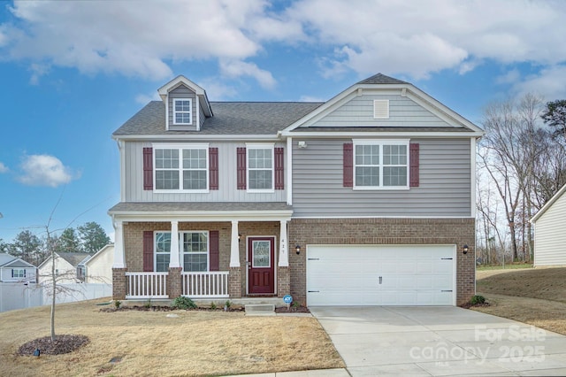 427 Carolina Hemlock Dr, Locust, NC 28097 - view of front of property with covered porch, brick siding, an attached garage, and driveway
