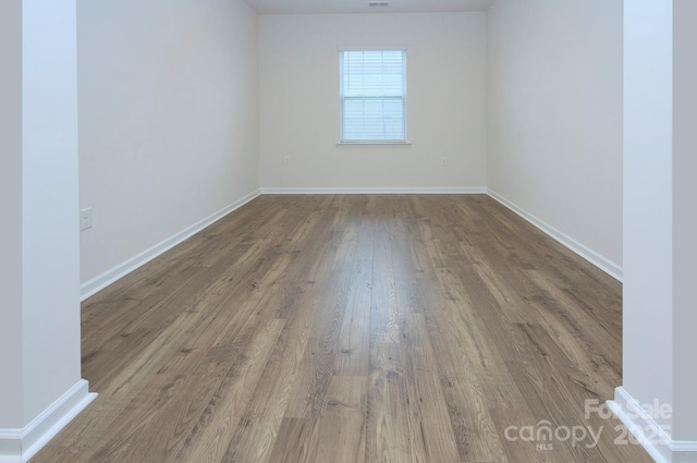427 Carolina Hemlock Dr, Locust, NC 28097 - spare room with wood finished floors and baseboards