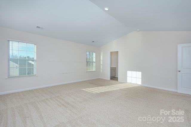 427 Carolina Hemlock Dr, Locust, NC 28097 - empty room featuring carpet floors, vaulted ceiling, plenty of natural light, and baseboards