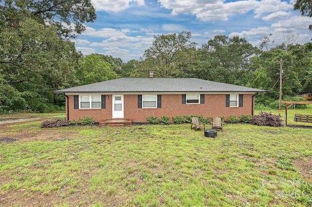 5222 Sikes Mill Rd, Monroe, NC 28110 - ranch-style house featuring a front yard, brick siding, and a chimney