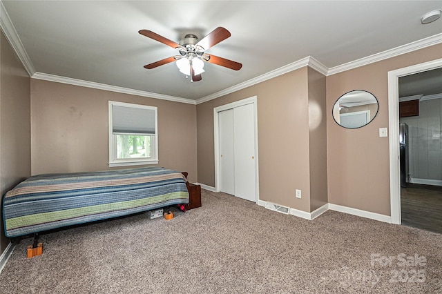 5222 Sikes Mill Rd, Monroe, NC 28110 - carpeted bedroom with ornamental molding, baseboards, a closet, and a ceiling fan