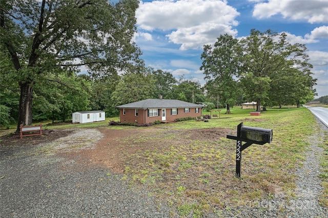 5222 Sikes Mill Rd, Monroe, NC 28110 - view of side of home featuring dirt driveway and a lawn