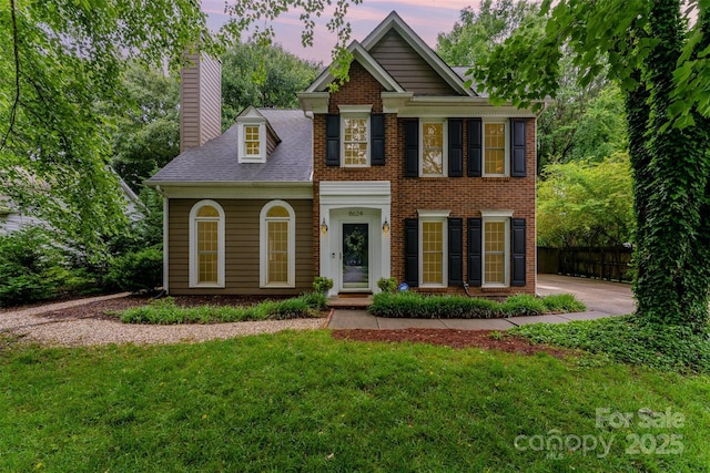 8624 Canter Post Dr, Charlotte, NC 28216 - colonial inspired home with a chimney and brick siding