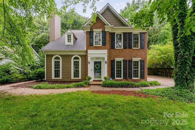 8624 Canter Post Dr, Charlotte, NC 28216 - view of front of house featuring a chimney, brick siding, and a shingled roof