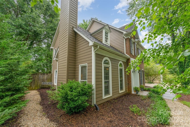 8624 Canter Post Dr, Charlotte, NC 28216 - view of side of home featuring a chimney