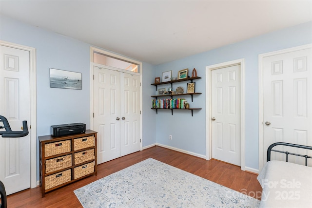 8624 Canter Post Dr, Charlotte, NC 28216 - bedroom with dark wood-type flooring and baseboards