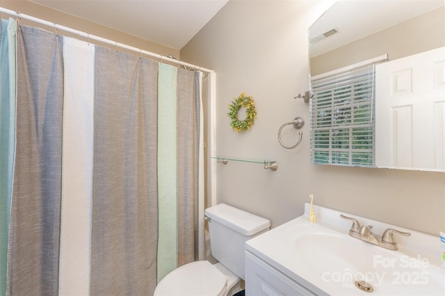 8624 Canter Post Dr, Charlotte, NC 28216 - bathroom with toilet, vanity, and a shower with shower curtain