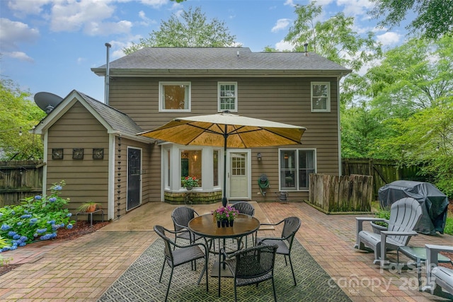 8624 Canter Post Dr, Charlotte, NC 28216 - rear view of property with a patio area and outdoor dining space