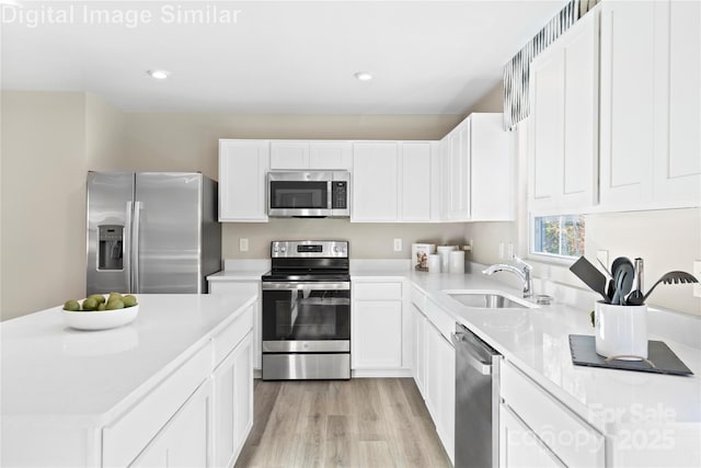 10108 Florentine Way, Charlotte, NC 28214 - kitchen with appliances with stainless steel finishes, a sink, light countertops, light wood-style floors, and recessed lighting