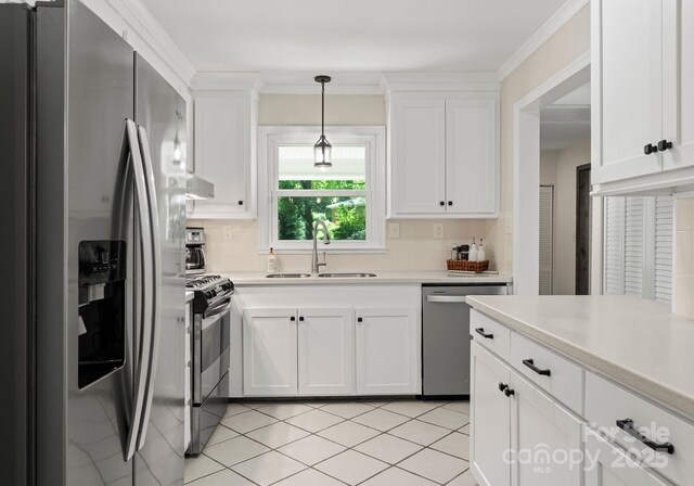 1226 Tarrington Ave, Charlotte, NC 28205 - kitchen with stainless steel appliances, a sink, backsplash, and light countertops