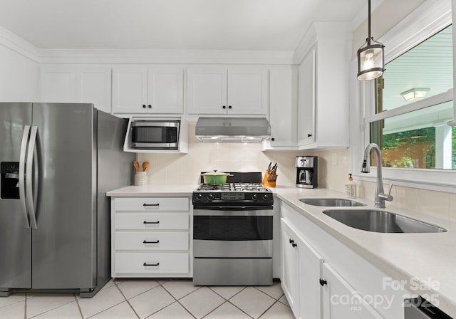 1226 Tarrington Ave, Charlotte, NC 28205 - kitchen with appliances with stainless steel finishes, ventilation hood, a sink, and light countertops