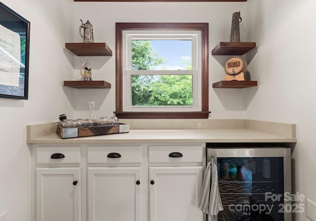 1226 Tarrington Ave, Charlotte, NC 28205 - kitchen featuring open shelves, beverage cooler, white cabinets, and light countertops