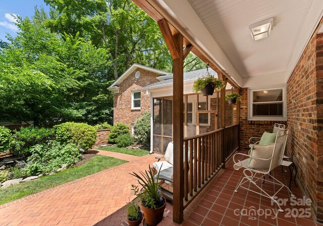 1226 Tarrington Ave, Charlotte, NC 28205 - view of patio featuring a sunroom