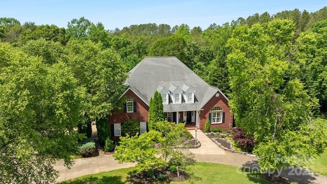 134 Brightmore Cir, Rutherfordton, NC 28139 - cape cod home with brick siding and a wooded view