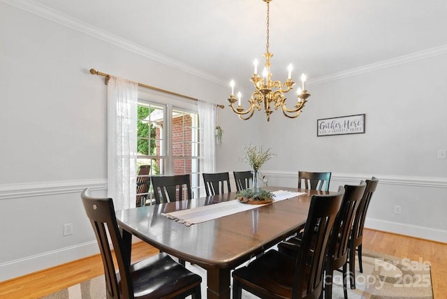 134 Brightmore Cir, Rutherfordton, NC 28139 - dining room with a chandelier, light wood-style flooring, crown molding, and baseboards