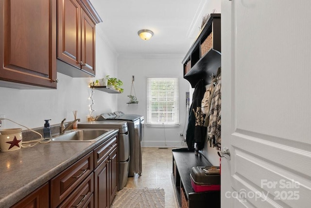 134 Brightmore Cir, Rutherfordton, NC 28139 - washroom with washer and clothes dryer, cabinet space, ornamental molding, and baseboards