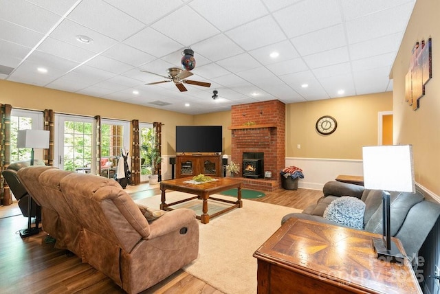 134 Brightmore Cir, Rutherfordton, NC 28139 - living room with wood finished floors, ceiling fan, a drop ceiling, and baseboards