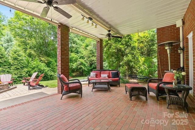 134 Brightmore Cir, Rutherfordton, NC 28139 - view of patio / terrace featuring a ceiling fan and an outdoor living space with a fire pit