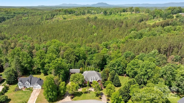 134 Brightmore Cir, Rutherfordton, NC 28139 - aerial view of property and surrounding area featuring a heavily wooded area and a mountain backdrop